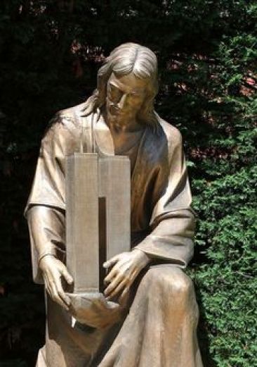 Sculpture of Jesus embracing the twin towers outside St. Ephrem Church in the Dyker Heights neighborhood of Brooklyn.